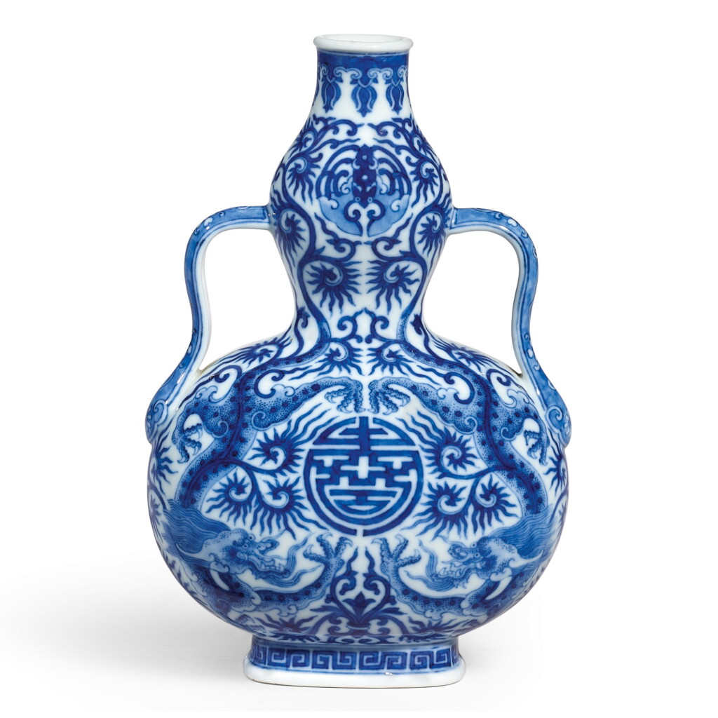View full screen - View 1 of Lot 3604. A FINE BLUE AND WHITE 'DRAGON' DOUBLE-GOURD VASE SEAL MARK AND PERIOD OF QIANLONG | 清乾隆 青花游龍獻壽如意耳葫蘆瓶 《大清乾隆年製》款.