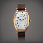 Montre bracelet tonneau en or jaune | Yellow gold tonneau-shaped wristwatch Vers 1920 | Circa 1920