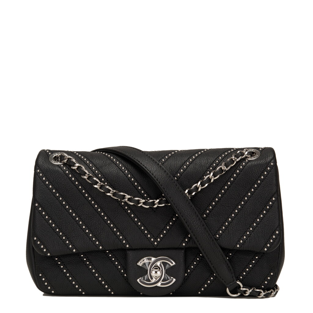 View full screen - View 1 of Lot 83. Chanel Studded Chevron Flap Bag of Black Calfskin with Silver Tone Hardware.