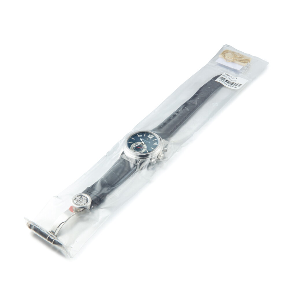 View full screen - View 1 of Lot 2051. PATEK PHILIPPE | REFERENCE 5960 A PLATINUM ANNUAL CALENDAR CHRONOGRAPH WRISTWATCH WITH POWER RESERVE AND DAY AND NIGHT INDICATION IN SINGLE FACTORY SEAL, CIRCA 2008" | 百達翡麗 | 型號5960 鉑金年曆計時腕錶,備動力儲備顯示及晝夜顯示,原廠未開封,機芯編號5542394,錶殼編號4525156,約2008年製".