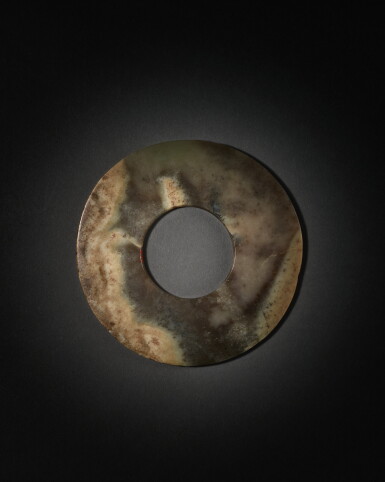 View full screen - View 1 of Lot 204. An archaic mottled brown and celadon jade disc (Bi), Neolithic period, Qijia culture | 新石器時代 齊家文化 玉璧.