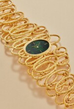 Reference 9850 D 72 'Elizabeth Taylor' | A yellow gold bracelet watch with malachite dial, Circa 1971