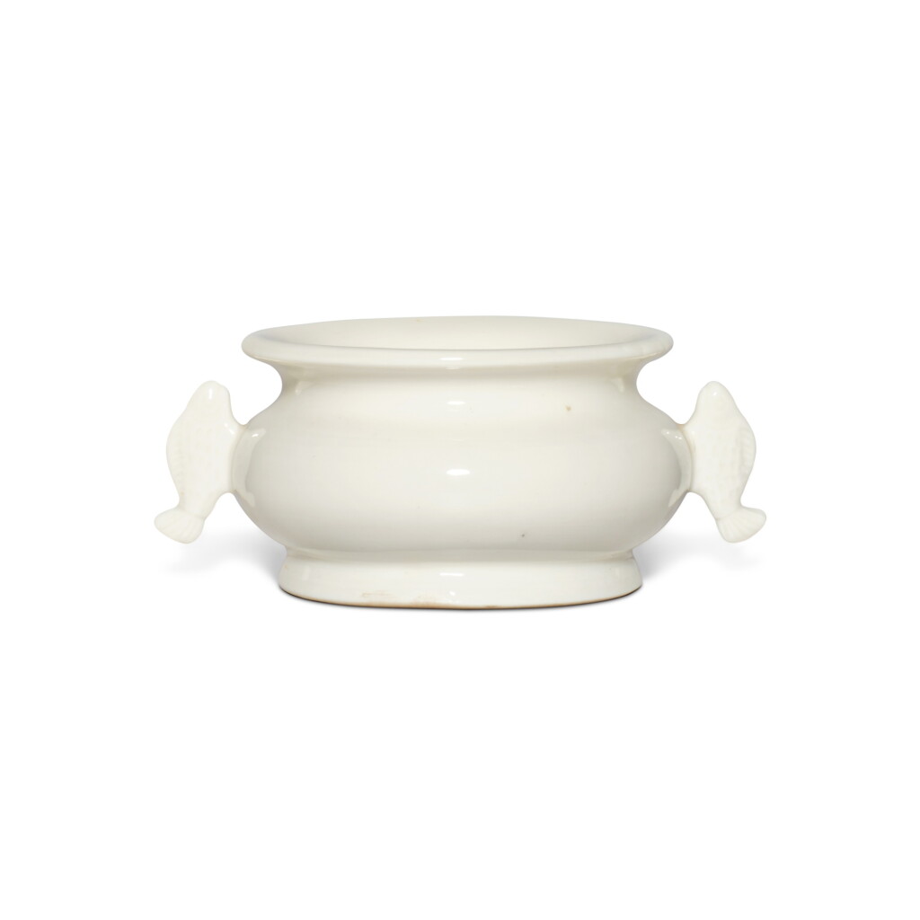 View full screen - View 1 of Lot 1373. A 'Dehua' white-glazed fish-handled censer | 德化白瓷魚耳爐.