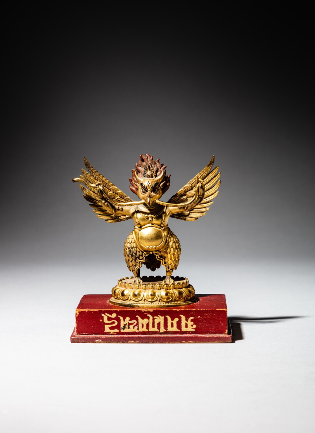 View full screen - View 1 of Lot 56. A gilt-bronze figure of Garuda, Nepal, 18th century | 尼泊爾 十八世紀 鎏金銅迦樓羅立像.