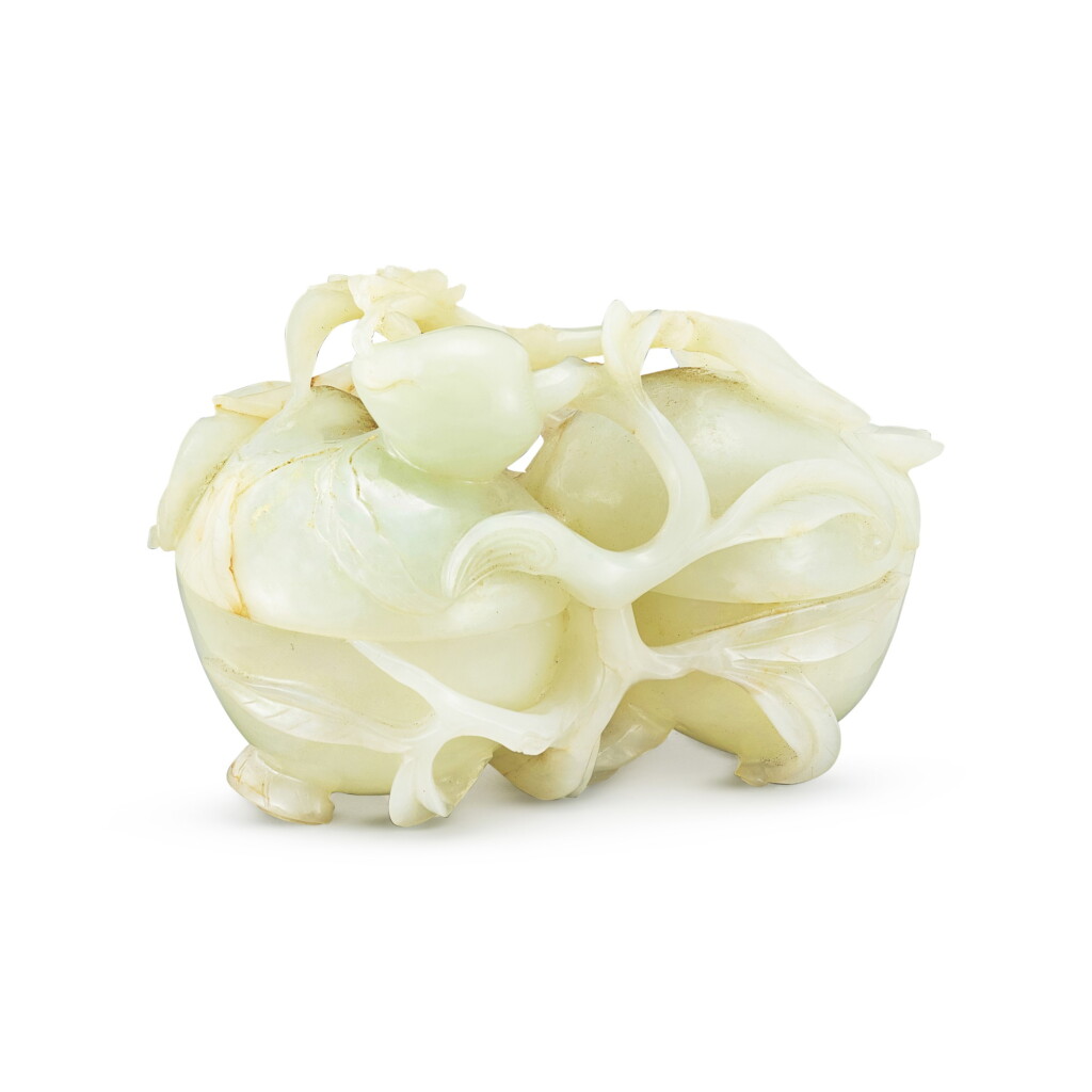 View full screen - View 1 of Lot 550. A white jade 'double peach' box and cover Qing dynasty, Qianlong period | 清乾隆 白玉雙桃式蓋盒.