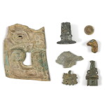 A group of seven bronze fittings and fragments, Zhou dynasty and later | 周及以後 各式銅飾及殘件一組七件