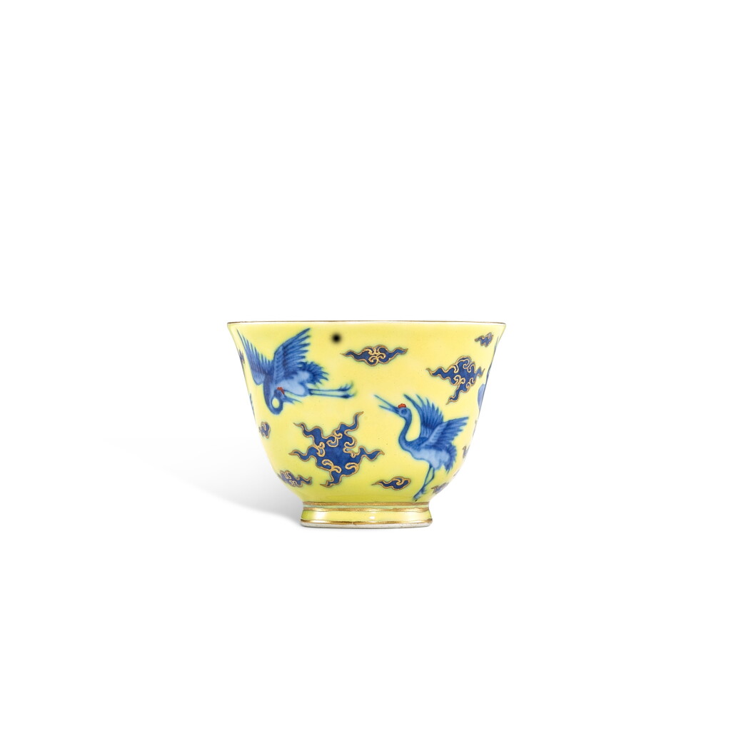 View full screen - View 1 of Lot 3356. A yellow-ground gilt-decorated and underglaze blue 'crane' cup, Seal mark and period of Qianlong | 清乾隆 黃地青花描金雲鶴紋小盃 《乾隆年製》款.