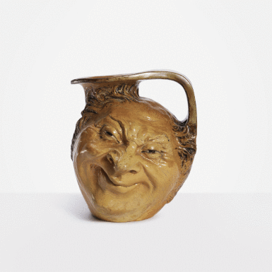 View full screen - View 1 of Lot 126. Double-Sided Face Jug.