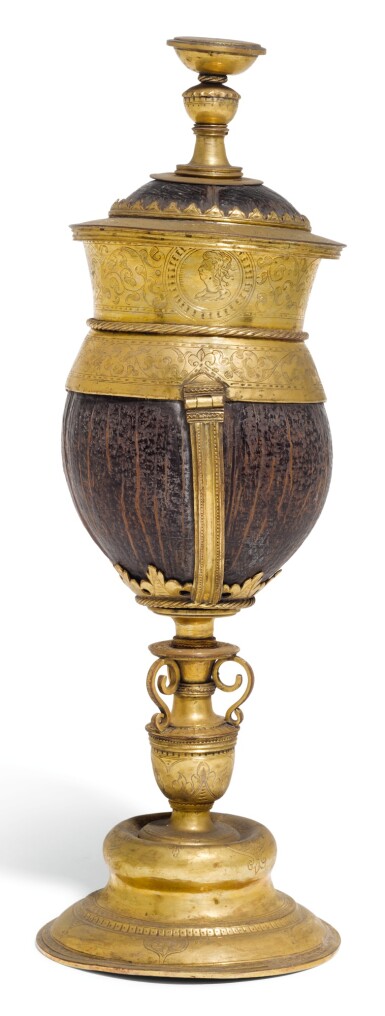 View full screen - View 1 of Lot 139. A GERMANIC GILT-COPPER MOUNTED COCONUT CUP AND COVER, UNMARKED, CIRCA 1580.