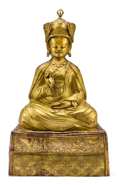 View full screen - View 1 of Lot 6048. A LARGE GILT-COPPER REPOUSSÉ FIGURE OF PADMASAMBHAVA,TIBET, 17TH CENTURY | 十七世紀 藏傳鎏金銅錘疊蓮花生大師坐像.