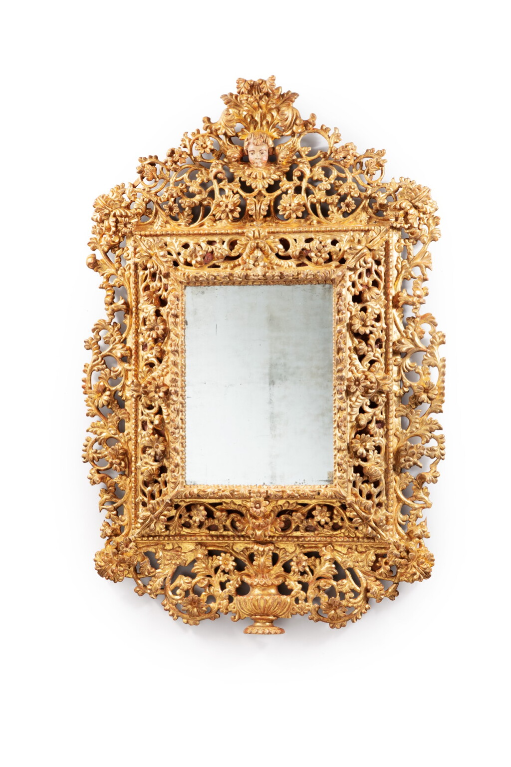 View full screen - View 1 of Lot 34. A rococo Spain or South Italian giltwood mirror frame, 18th century | Cadre en bois sculpté et redoré formant miroir, Espagne ou Italie du Sud, XVIIIeme siècle.