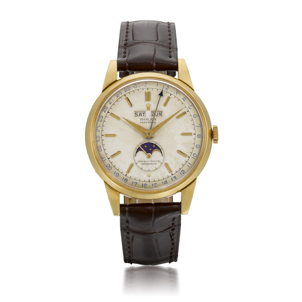 Voir en plein écran - Voir 1 du lot 366. ROLEX | PADELLONE, REF 8171, YELLOW GOLD WRISTWATCH WITH DAY, DATE, MONTH AND MOONPHASE, CIRCA 1952.
