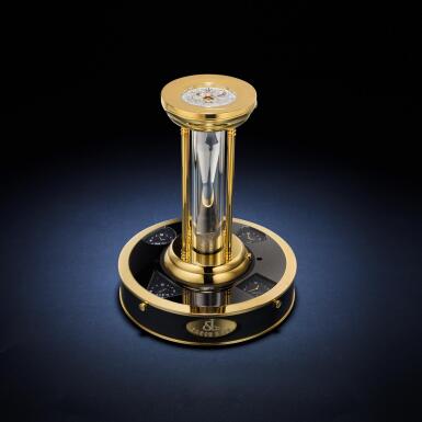 View full screen - View 1 of Lot 91. A limited edition gilt brass mother-of-pearl and diamond-set hour-glass timer with two dials and a four time zone illuminated stand, Circa 2010 .