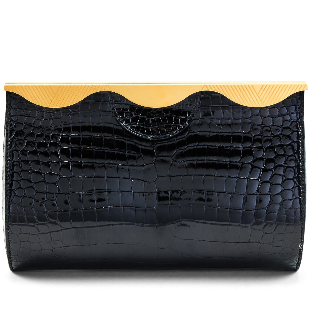 View full screen - View 1 of Lot 130. Vintage Black Shiny Porosus Crocodile Clutch Gold Hardware, 1998.