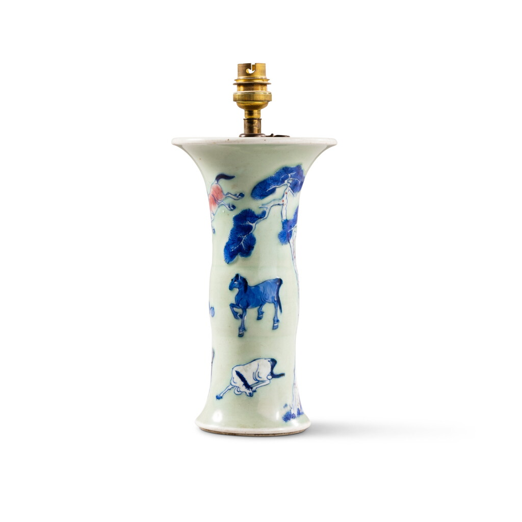 View full screen - View 1 of Lot 71. A small celadon-ground underglaze blue and copper red 'Eight horses of Muwang' beaker vase, Qing dynasty, 18th century | 清十八世紀 粉青地青花釉裏紅駿馬圖花觚 .
