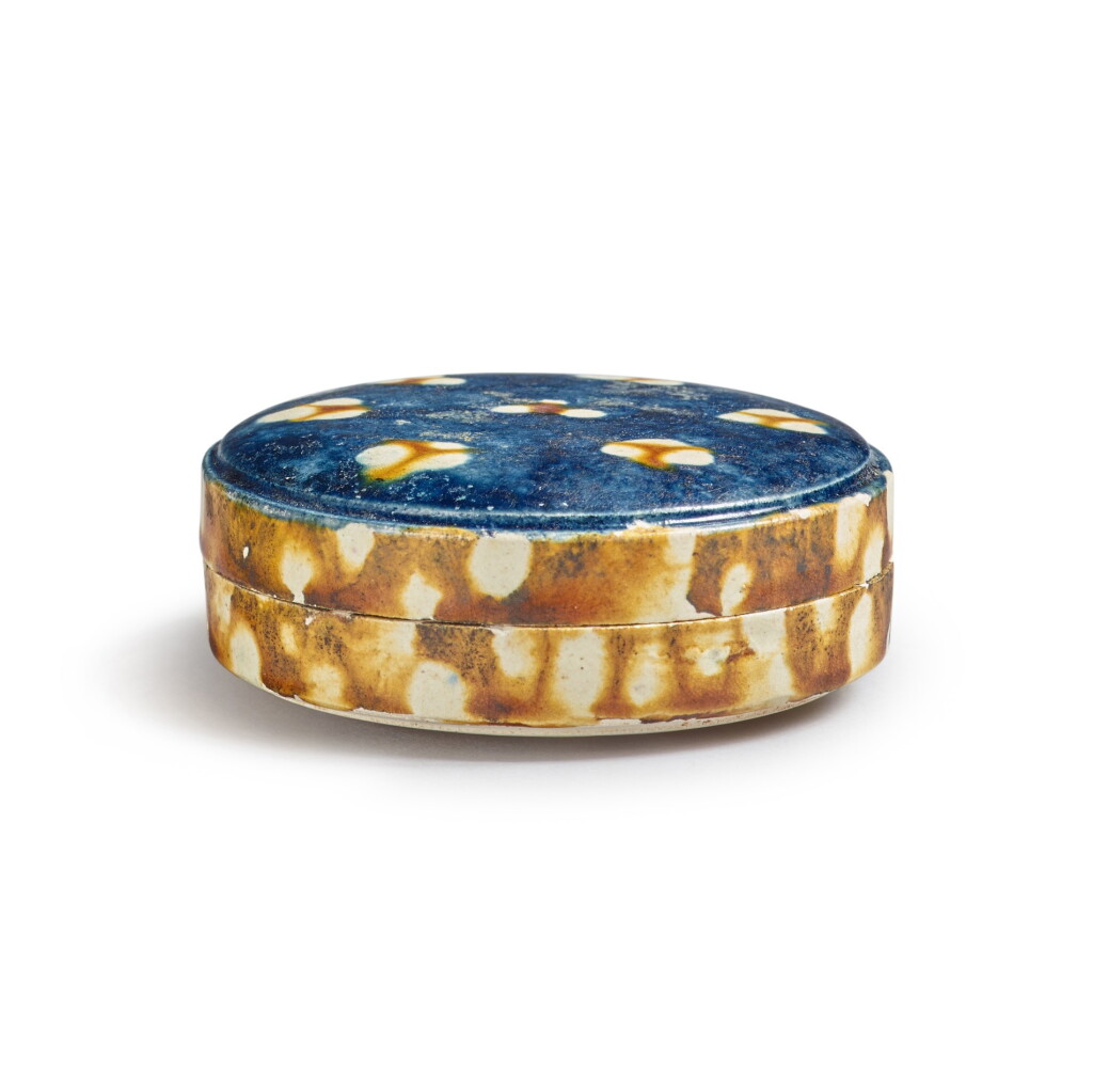 View full screen - View 1 of Lot 177. A sancai and blue-glazed pottery box and cover, Tang dynasty | 唐 三彩加藍蓋盒.