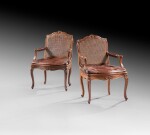 A pair of carved walnut armchairs, Louis XV | Paire de fauteuils à dossier plat en noyer sculpté d'époque Louis XV
