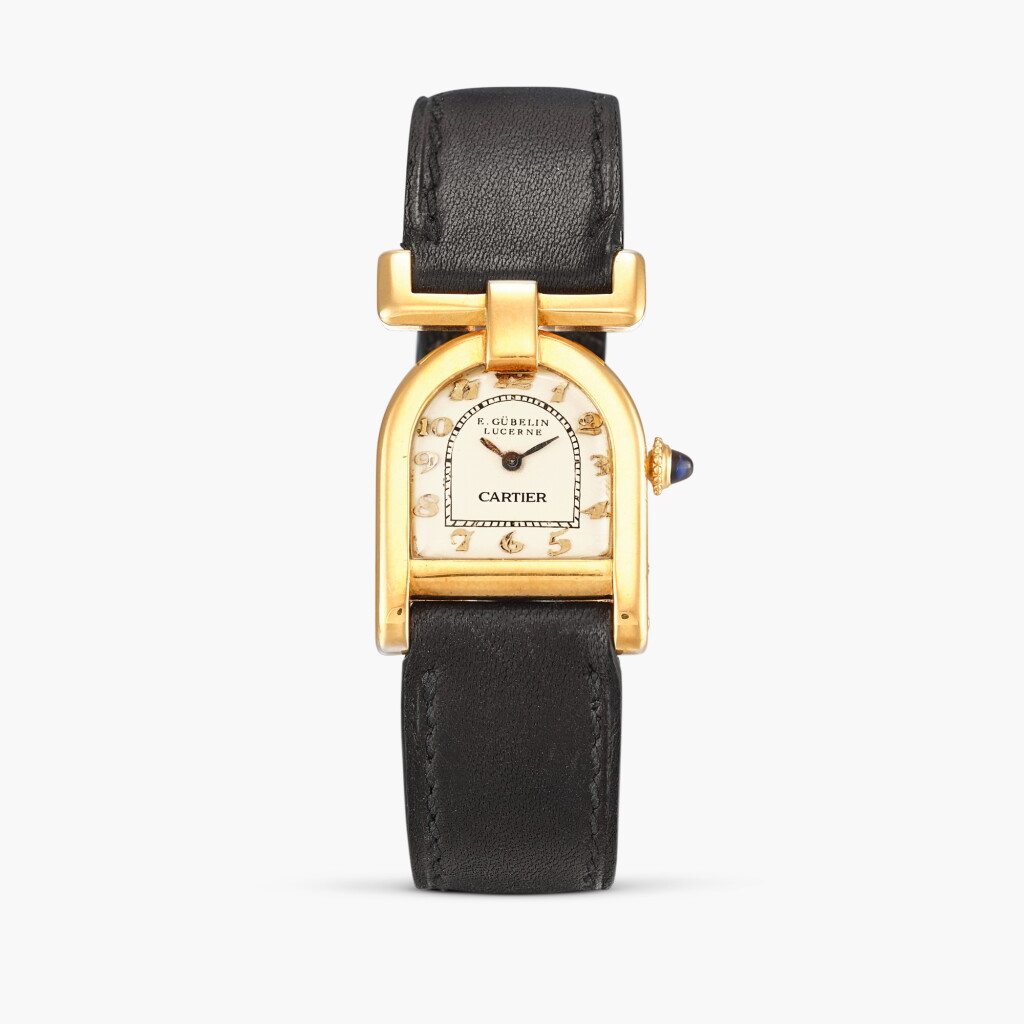 View full screen - View 1 of Lot 2291. E. Gübelin, Lucerne retailed | Étrier | A yellow gold stirrup-form wristwatch, Circa 1929.