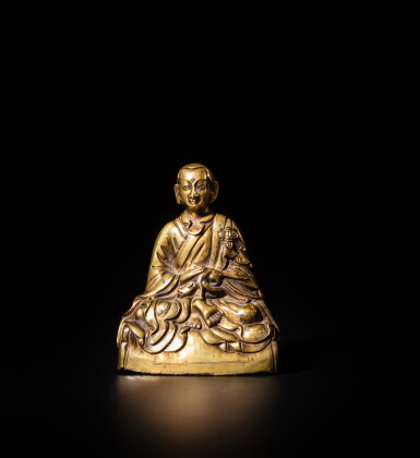 View full screen - View 1 of Lot 82. A bronze seated figure of the arhat Bakula, Tibet, 18th century | 十八世紀 藏傳銅阿羅漢坐像.