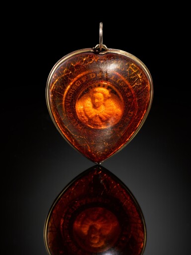 View full screen - View 1 of Lot 246. Amber pendant with a portrait of Queen Elizabeth I (1533-1603).