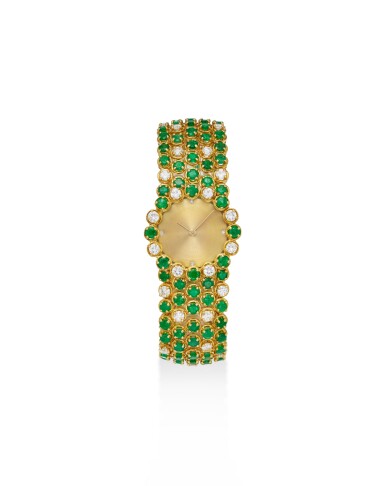 View full screen - View 1 of Lot 1820. A yellow gold, diamond and emerald-set bracelet watch, Circa 1975.