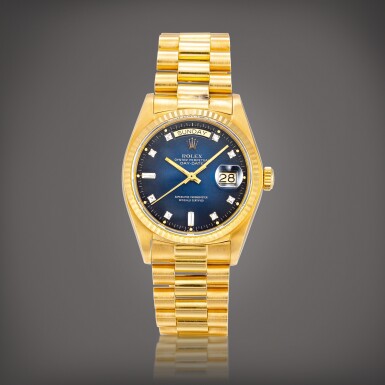 View full screen - View 1 of Lot 2199. Day-Date, Reference 18038 | A yellow gold and diamond-set wristwatch with day, date, blue dégradé dial and bracelet, Circa 1979 | 勞力士 | "Day-Date" 型號18038 | 黃金鑲鑽石鏈帶腕錶,備日期、星期顯示及藍色錶盤,約1979年製.
