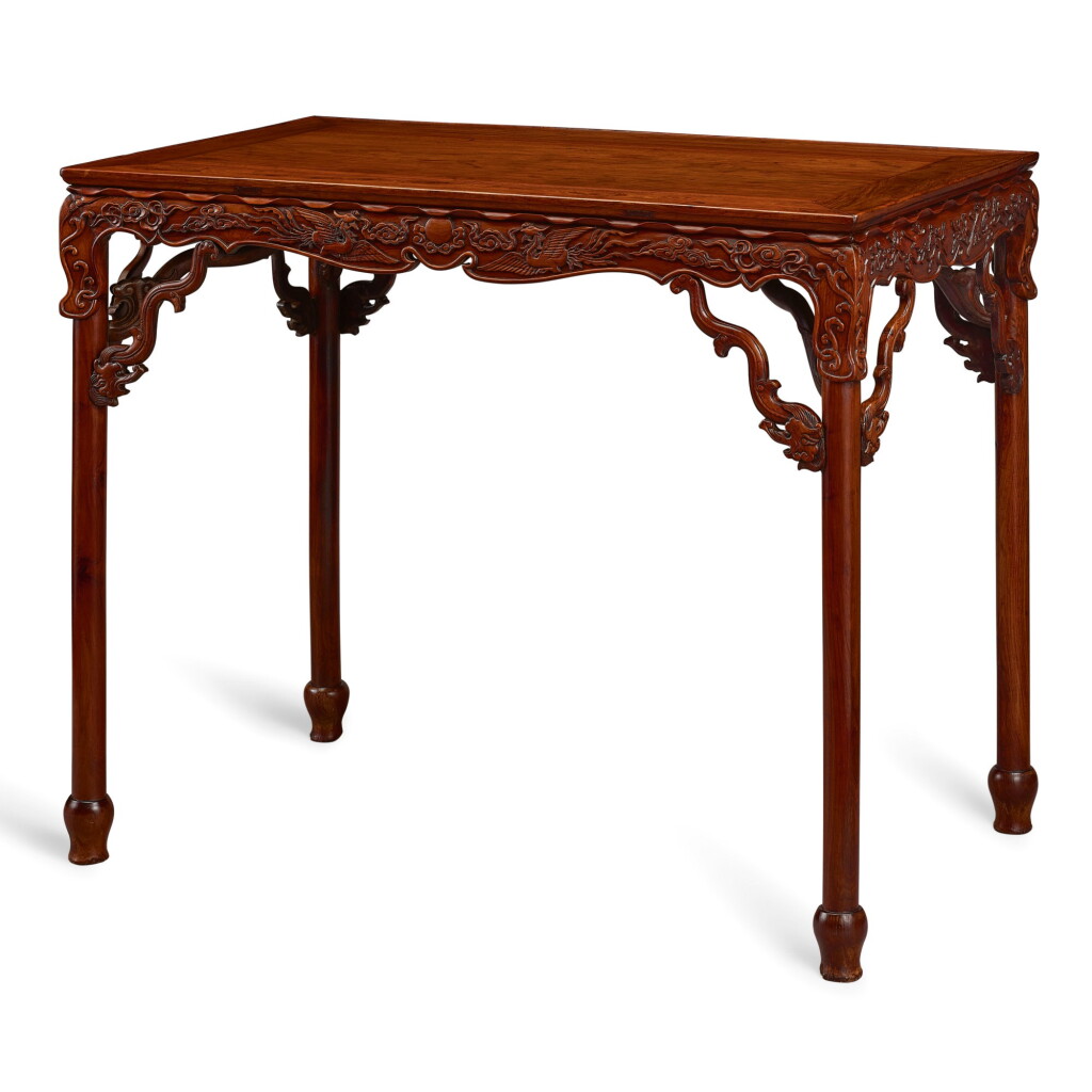 View full screen - View 1 of Lot 99. AN IMPORTANT AND VERY RARE HUANGHUALI TABLE, BANZHUO MING DYNASTY, 16TH – 17TH CENTURY | 明十六至十七世紀 黃花梨雕龍鳳花鳥紋束腰矮桌展腿式半桌.