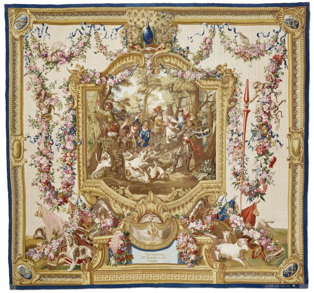 View full screen - View 1 of Lot 107. A Gobelins Tapestry depicting Sancho's Cowardice during the Hunt, from the Don Quixote Series, woven by the Workshop of Michel Audran, after designs by Charles Antoine Coypel, the alentour after a design by Jean-Baptiste Belin de Fontenay the Elder, dated 1760.