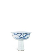 A rare blue and white 'dragon' stem cup, Yuan dynasty | 元 青花趕珠雲龍紋高足盃
