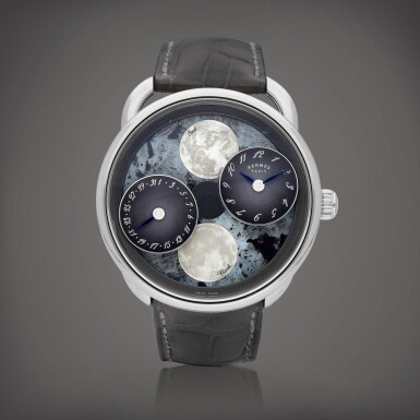 View full screen - View 1 of Lot 8613. Arceau L' Heure de la Lune, Reference AR1.890f | A white gold wristwatch with date, moon phases and mother-of-pearl dial, Circa 2022 | 愛馬仕 | Arceau L' Heure de la Lune 型號AR1.890f | 白金腕錶,備日期、月相顯示及珠母貝錶盤,約2022年製.