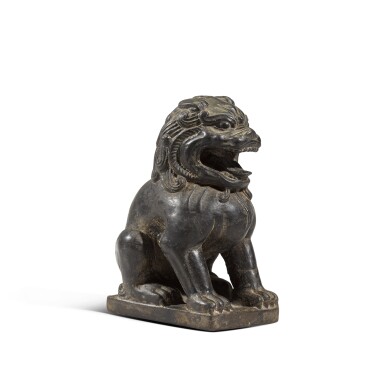View full screen - View 1 of Lot 119. A small black limestone figure of a lion, Tang dynasty | 唐 黑石雕瑞獅坐像.