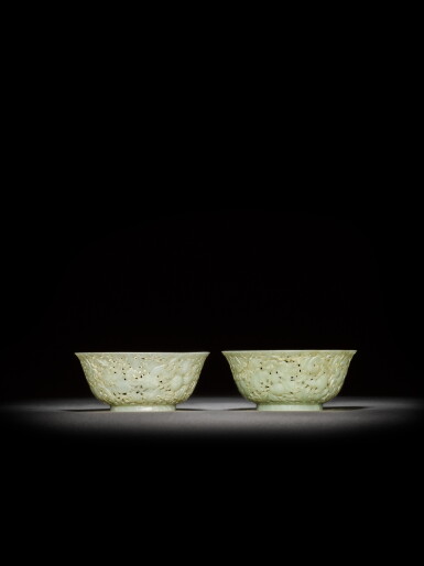 View full screen - View 1 of Lot 18. A pair of reticulated pale celadon jade 'gourd' bowls, Qing dynasty, 18th century | 清十八世紀 青白玉鏤雕葫蘆紋盌一對.