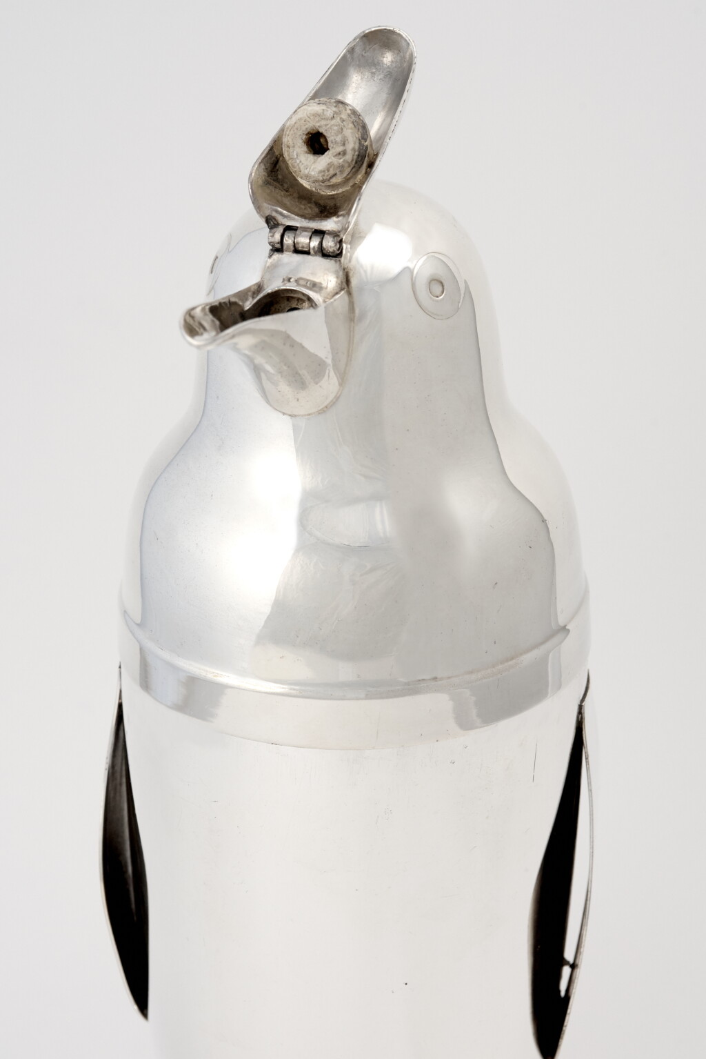 View full screen - View 1 of Lot 6. AN AMERICAN SILVER-PLATED PENGUIN-FORM COCKTAIL SHAKER .