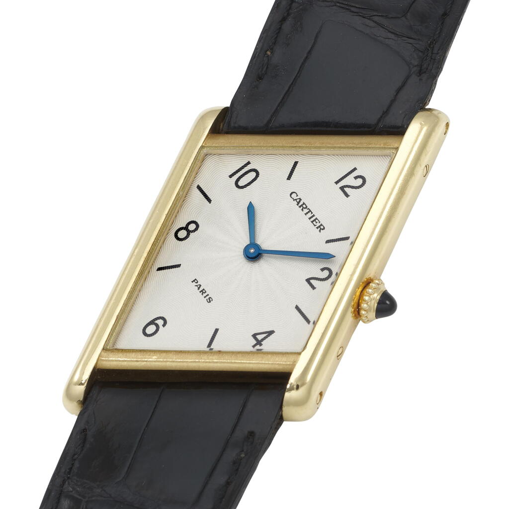 View full screen - View 1 of Lot 197. Tank Asymetrique | A yellow gold asymetrical wristwatch | Circa 1996.