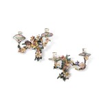 A pair of Austrian gilt-bronze, painted enamel and porcelain two-light wall-lights, Vienna, circa 1760, attributed to Christoph Jünger