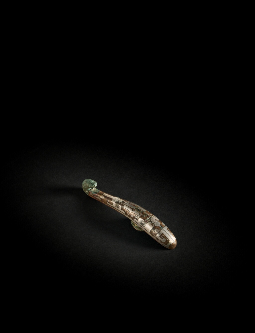 View full screen - View 1 of Lot 142. A rare silver-inlaid bronze belt buckle, Warring States period - Han dynasty .