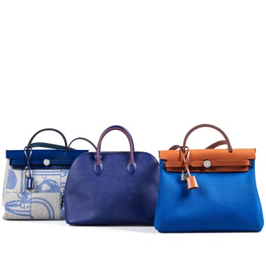 View full screen - View 1 of Lot 368. Set of Three: Natural Vache Hunter and Bleu Frida Toile Herbag Zip 31 Palladium Hardware, 2022; Bleu Electrique Epsom Bolide 1923 Tressage Palladium Hardware, 2018 and Bleu Sapphire Vache Hunter and Brides de Gala Toile Herbag Zip 31 Palladium Hardware, 2021.