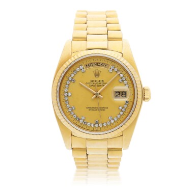 View full screen - View 1 of Lot 146. ROLEX | REFERENCE 18038 DAY-DATE A YELLOW GOLD AND DIAMOND-SET WRISTWATCH WITH DAY, DATE AND BRACELET, CIRCA 1982.