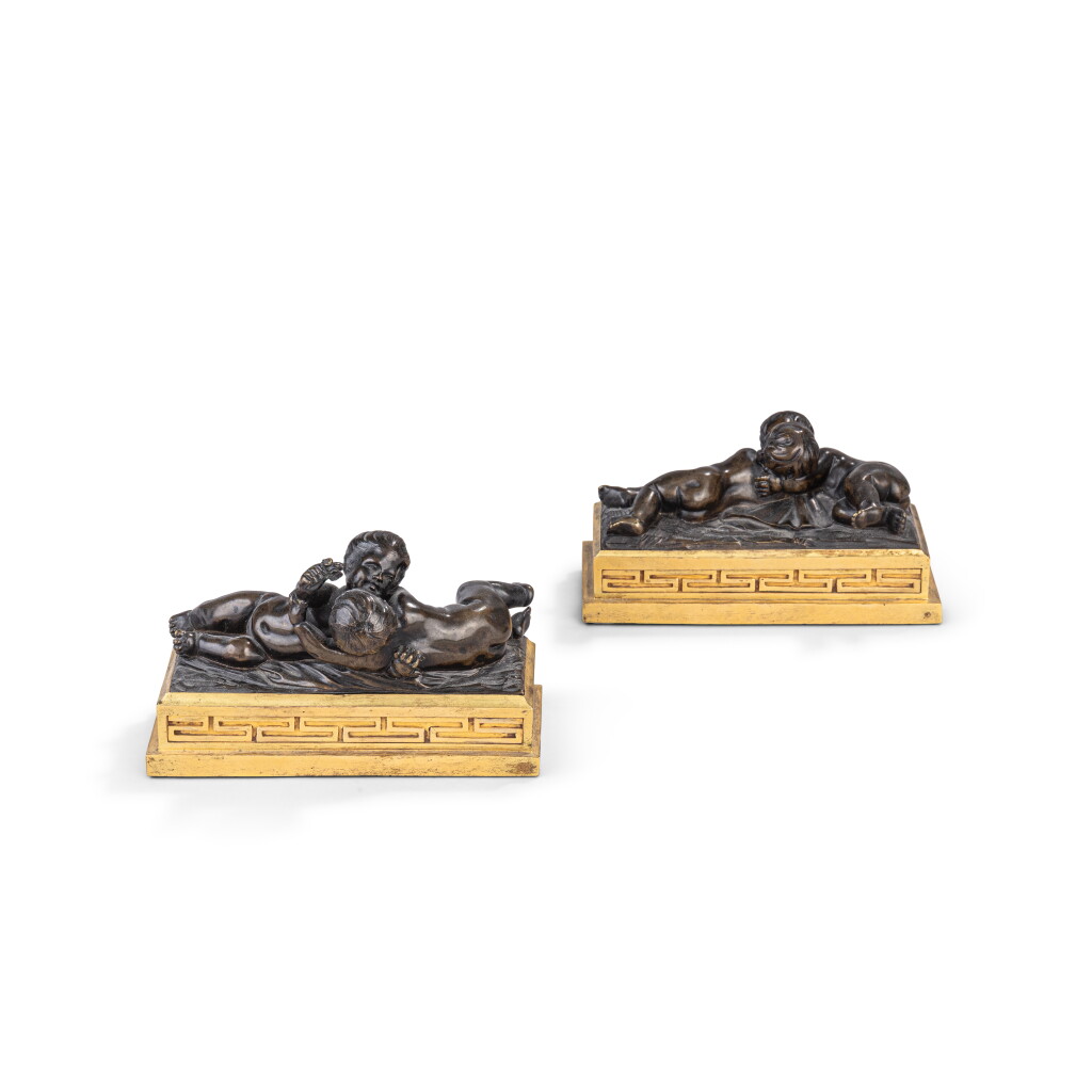 View full screen - View 1 of Lot 431. A pair of Louis XVI gilt-bronze and patinated bronze paper-weights, in the manner of François Duquesnoy, circa 1775.