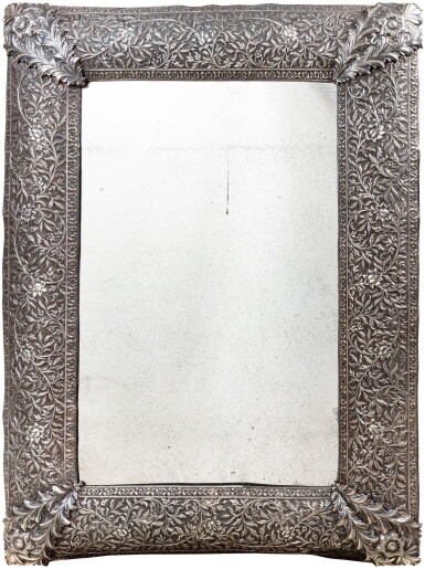 View full screen - View 1 of Lot 115. A large Mughal Indian silver repoussé mirror, 19th century | Grand miroir moghol en argent repoussé, Inde, XIXe siècle.