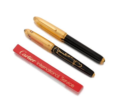 View full screen - View 1 of Lot 106. Two 'Pasha de Cartier' pens (Due penne 'Pasha' Cartier).