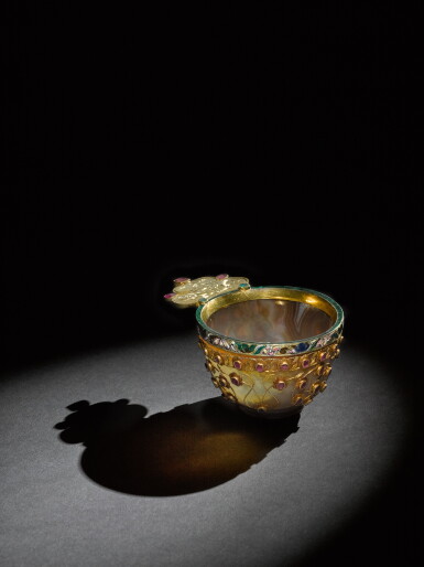 View full screen - View 1 of Lot 186. An Ottoman agate cup set with rubies and emeralds, Turkey, 17th century, with enamelled gold-mount with cipher of Empress Catherine II, dated 1789.