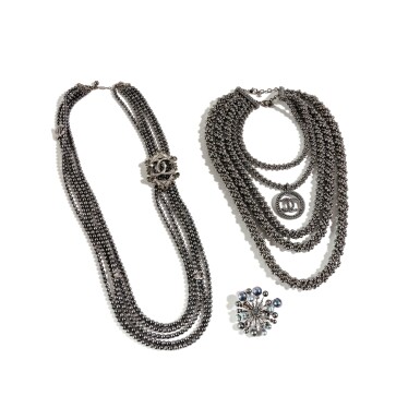 View full screen - View 1 of Lot 9. Set of A Titanium Multi-Row Necklace, Métiers d'Art Paris Cosmopolite Pre-Fall 2017, A Titanium Necklace Fall 2017 and A Brooch, Ready-to-Wear Fall 2017 .