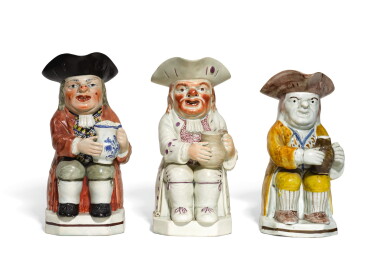 View full screen - View 1 of Lot 70. THREE PEARLWARE TOBY JUGS, CIRCA 1815 AND 1800, STAFFORDSHIRE AND PROBABLY YORKSHIRE.