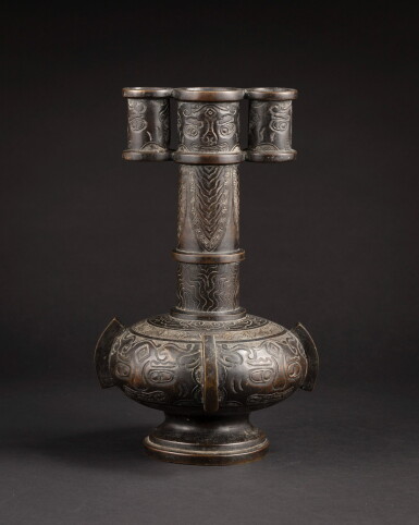 View full screen - View 1 of Lot 67. A bronze 'arrow' vase, touhu Ming dynasty, 16th-17th century | 明十六至十七世紀 銅饕餮紋投壺.