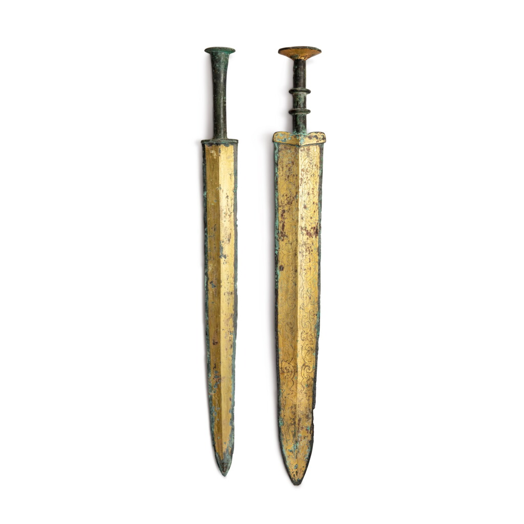View full screen - View 1 of Lot 22. Two archaic gilt-bronze swords (Jian), Warring States period - Western Han dynasty | 戰國至西漢 銅鎏金龍紋劍及銅鎏金劍.
