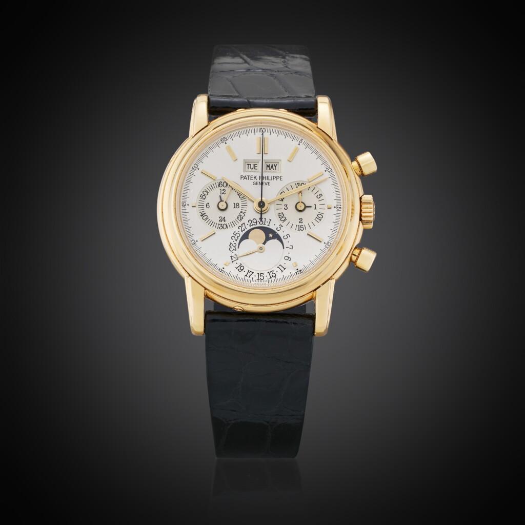 View full screen - View 1 of Lot 39. Reference 3970 'First Series' | A yellow gold perpetual calendar chronograph wristwatch with moon phases, The second example ever produced numbered 875’001, Owned and Worn by Tom Brady, Made in 1986.
