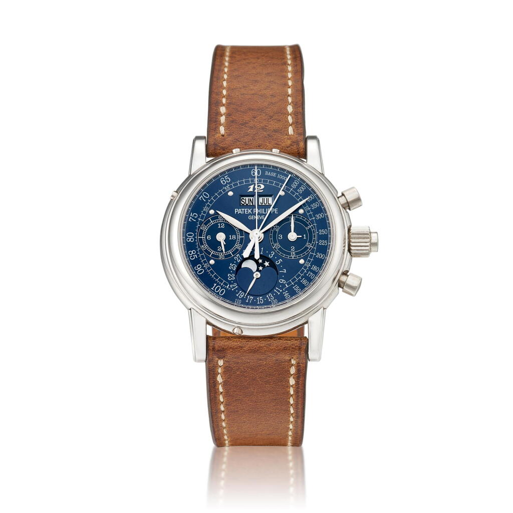View full screen - View 1 of Lot 2208. Reference 5004 | A highly important and possibly unique platinum perpetual calendar split seconds chronograph wristwatch with moon phases, 24 hours, leap year indication, Breguet numeral at 12 o'clock and special blue tachymetre dial, Circa 2009, Formerly in the collection of Eric Clapton, CBE | 百達翡麗 |型號5004 | 非常重要及獨特鉑金萬年曆追針計時腕錶,備月相、24小時、閏年顯示、12時寶璣式時標及特製藍色測速錶盤,約2009年製,原為 Eric Clapton, CBE 收藏.