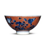 An iron-red-ground blue and white 'floral' bowl, Qing dynasty, Kangxi period | 清康熙 礬紅地青花花卉紋盌