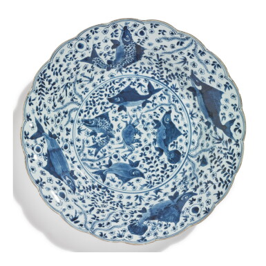 View full screen - View 1 of Lot 486. A LARGE CHINESE BLUE AND WHITE LOBED 'FISH' DISH, QING DYNASTY, KANGXI PERIOD.